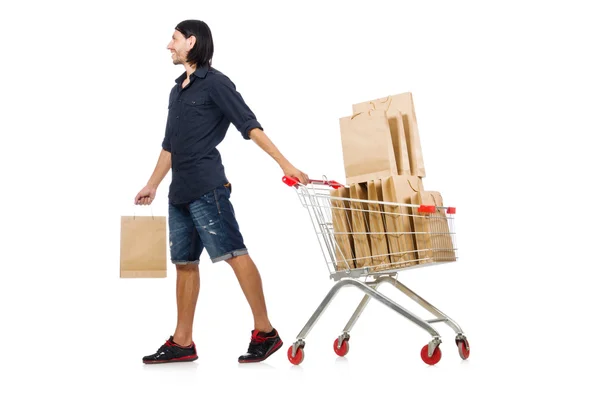 Uomo shopping con carrello supermercato isolato su bianco — Foto Stock