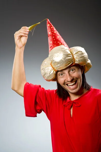 Funny wizard wearing red dress — Stock Photo, Image