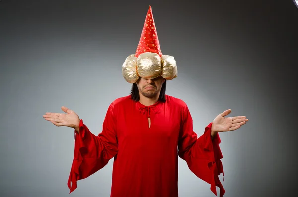 Funny wizard wearing red dress — Stock Photo, Image