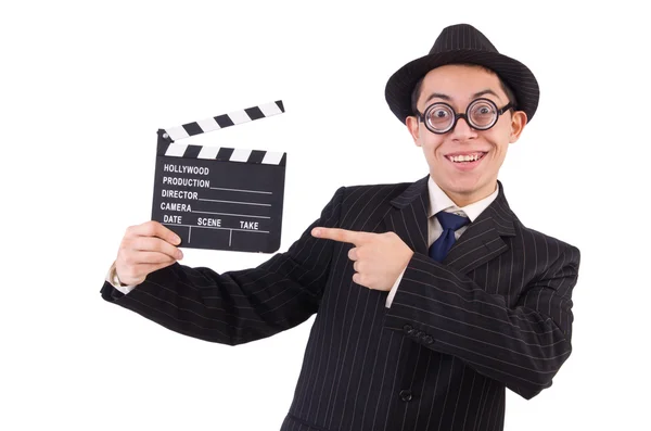 Uomo divertente in abito elegante con clapboard film isolato su bianco — Foto Stock