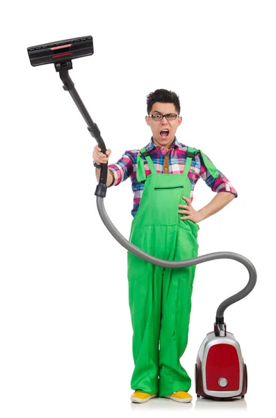 Funny man in green coveralls vacuum cleaning — Stock Photo, Image
