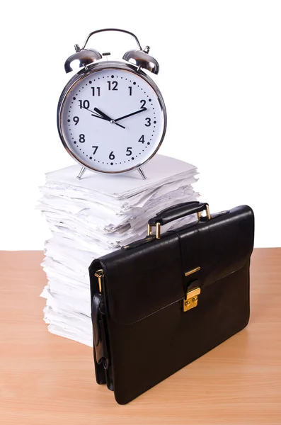 Stack of papers and clock isolated on white — Stock Photo, Image