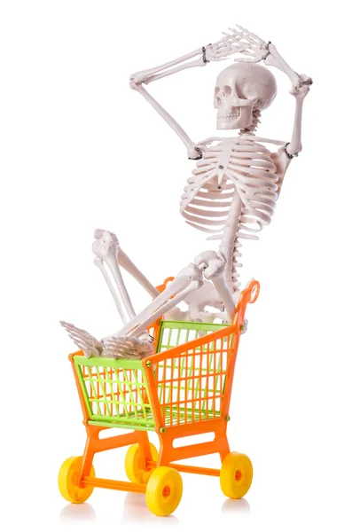 Skeleton with shopping cart trolley isolated on white — Stock Photo, Image