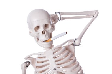 Skeleton smoking cigarette isolated on white clipart
