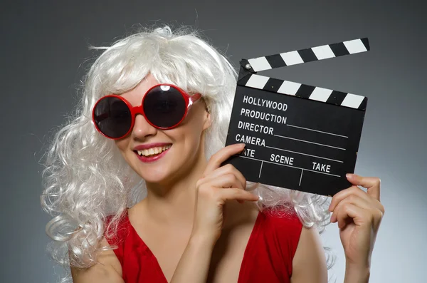 Blond woman with movie board — Stock Photo, Image