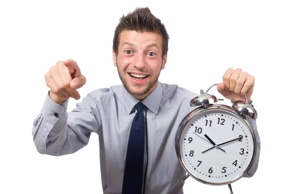 Man met klok probeert te voldoen aan de deadline geïsoleerd op wit — Stockfoto