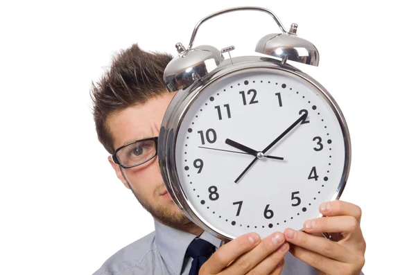 Man met klok probeert te voldoen aan de deadline geïsoleerd op wit — Stockfoto
