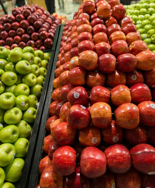 Apple stall in big supermarket — Stock Photo, Image