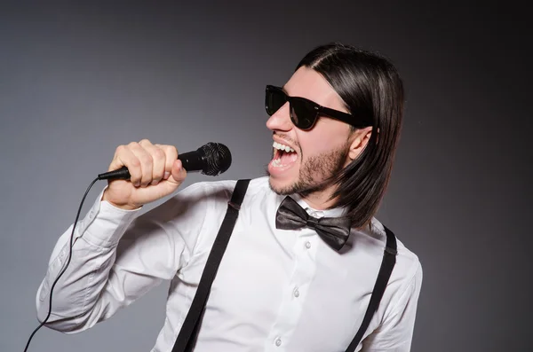 Funny singer with microphone at the concert — Stock Photo, Image