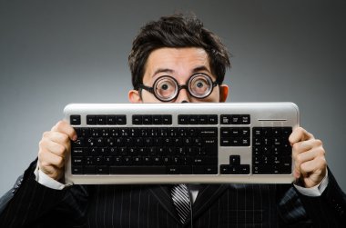 Comouter geek with computer keyboard clipart