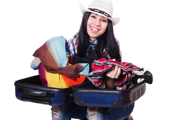 Woman trying to pack too much isolated on white — Stock Photo, Image