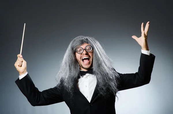 Funny conductor with long grey hair — Stock Photo, Image