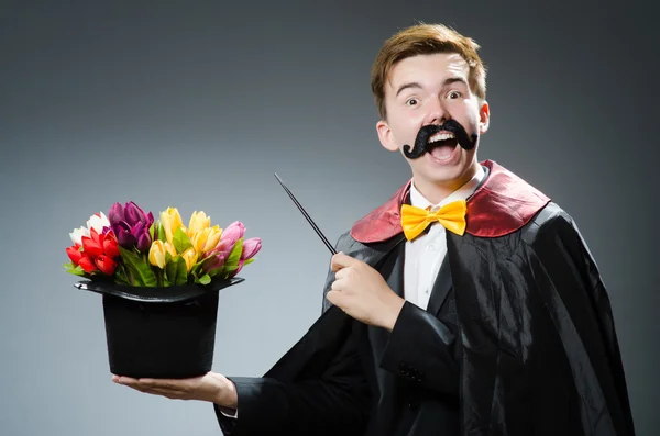 Funny magician with wand and hat — Stock Photo, Image