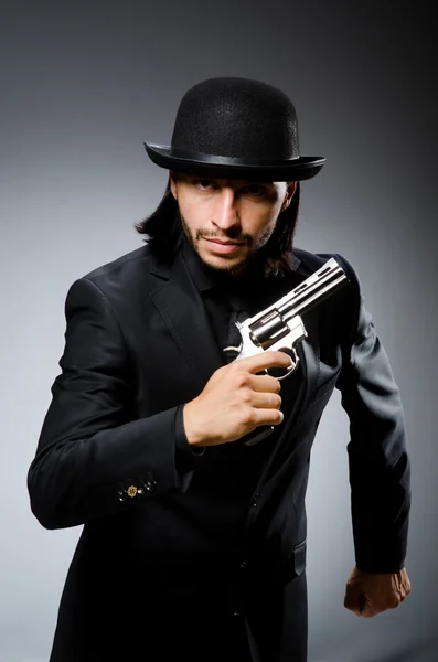 Man with gun and vintage hat — Stock Photo, Image