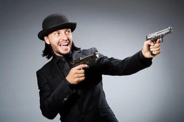 Man wearing vintage hat with gun — Stock Photo, Image