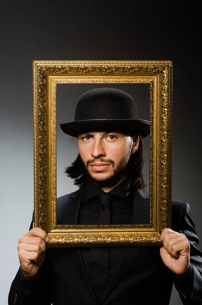 Man in topper hat and picture frame — Stock Photo, Image