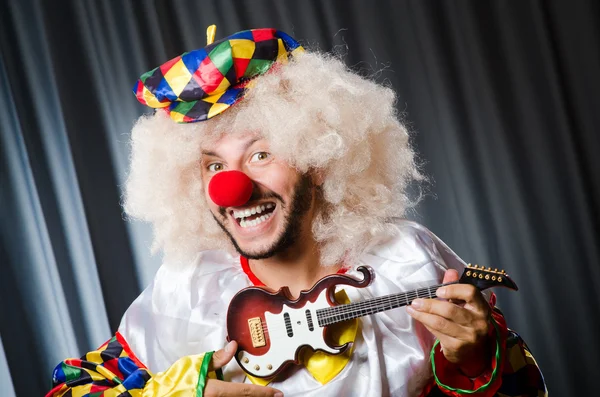 Angry clown with guitar in funny concept — Stock Photo, Image