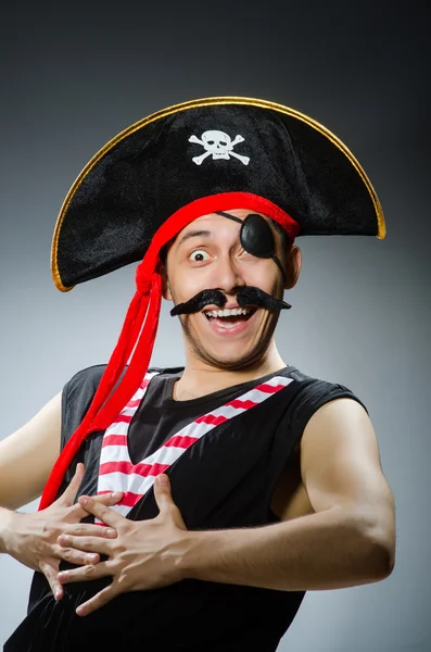 Funny pirate in the dark studio — Stock Photo, Image