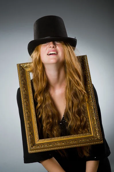 Woman with vintage hat and picture frame — Stock Photo, Image