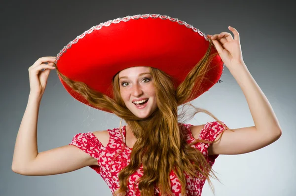 Mexican woman wearing red sombrero — Stock Photo, Image