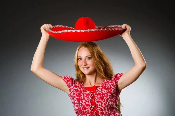 Mexican woman wearing red sombrero — Stock Photo, Image