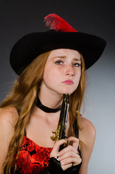 Pirate with gun against grey background — Stock Photo, Image