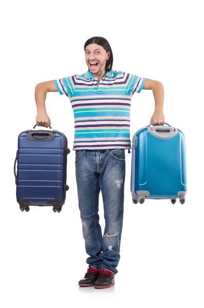 Genç adam beyaz bavullarla seyahat ediyor. — Stok fotoğraf