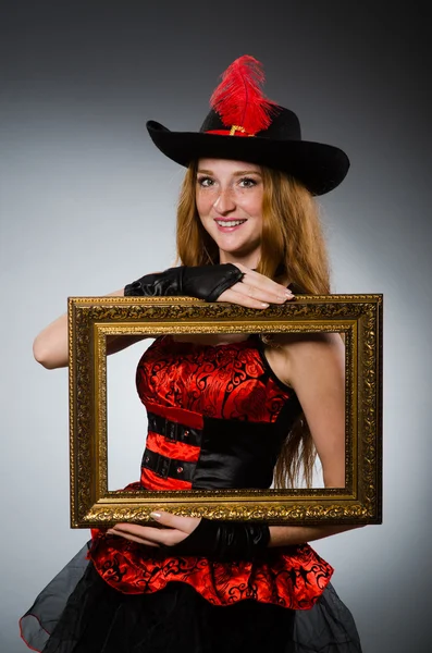 Woman pirate with picture frame — Stock Photo, Image