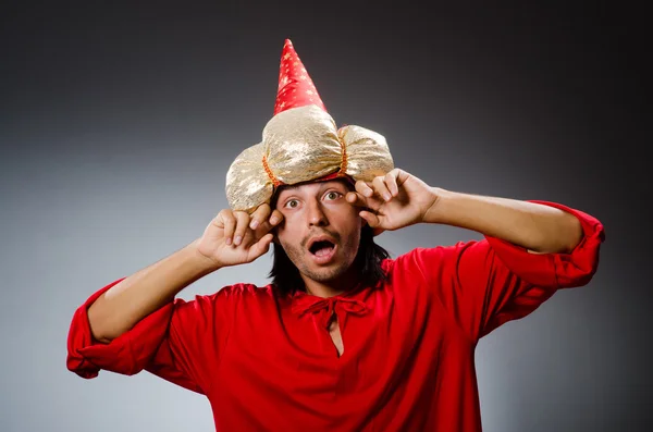 Funny wizard wearing red dress — Stock Photo, Image