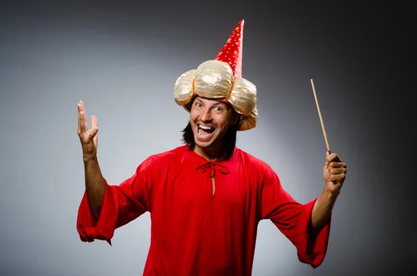 Funny wizard wearing red dress — Stock Photo, Image