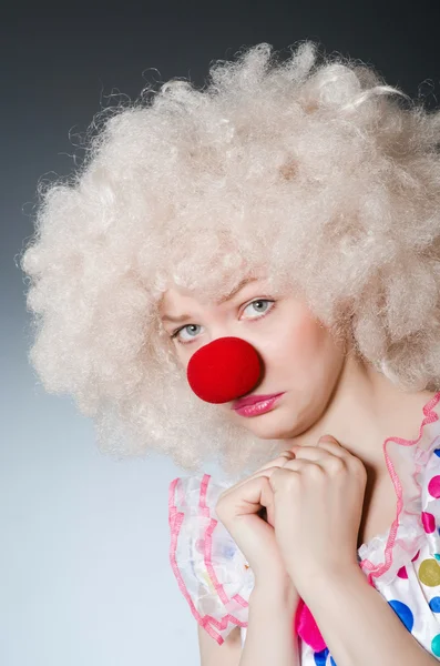 Clown with white wig against grey background — Stock Photo, Image