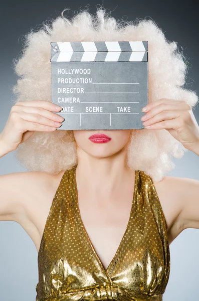 Blond woman with movie board — Stock Photo, Image