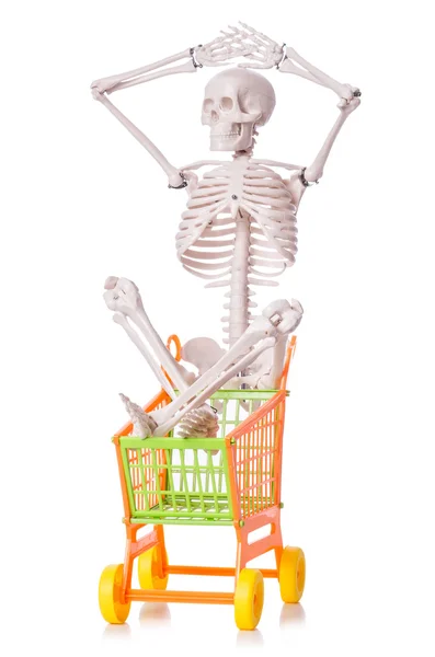 Esqueleto con carro de la compra aislado en blanco —  Fotos de Stock