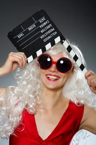 Blond woman with movie board — Stock Photo, Image