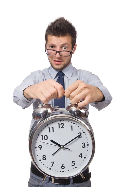 Man met klok probeert te voldoen aan de deadline geïsoleerd op wit — Stockfoto