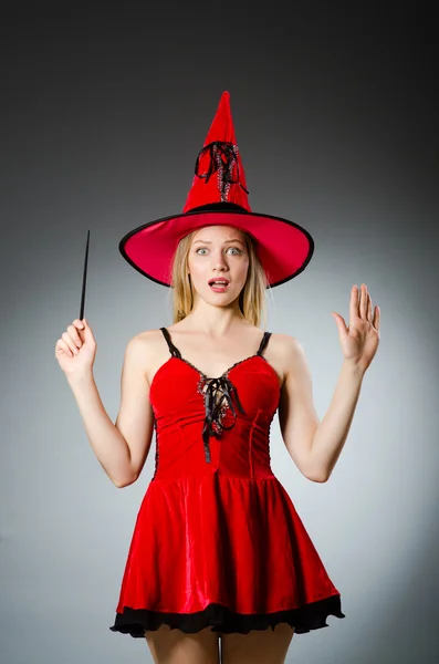 Woman magician doing her tricks with wand — Stock Photo, Image