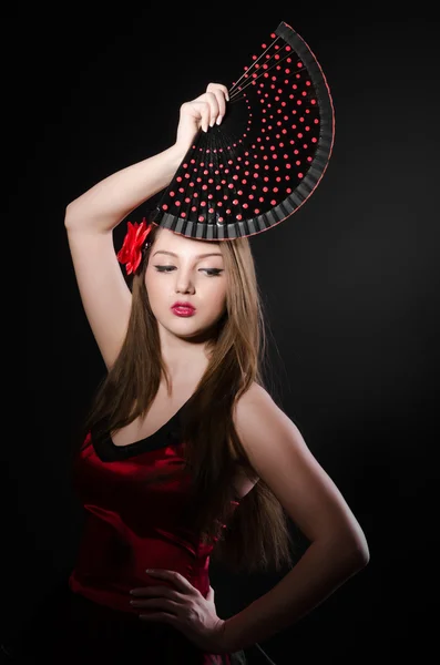 Mulher bonita com flor e ventilador — Fotografia de Stock