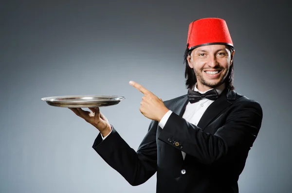 Waiter wearing traditional turkish hat — Stock Photo, Image