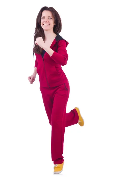 Женщина в красном костюме делает упражнения на белом — стоковое фото