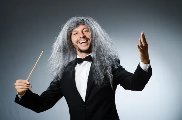 Funny conductor with long grey hair — Stock Photo, Image