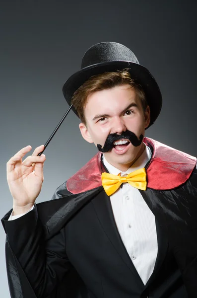Funny magician with wand and hat — Stock Photo, Image