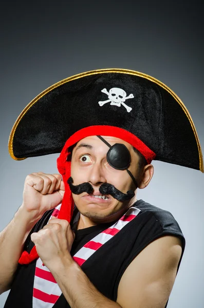 Funny pirate in the dark studio — Stock Photo, Image