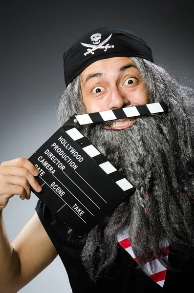 Old pirate with movie board — Stock Photo, Image