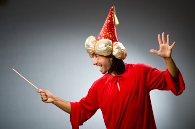 Funny wizard wearing red dress clipart