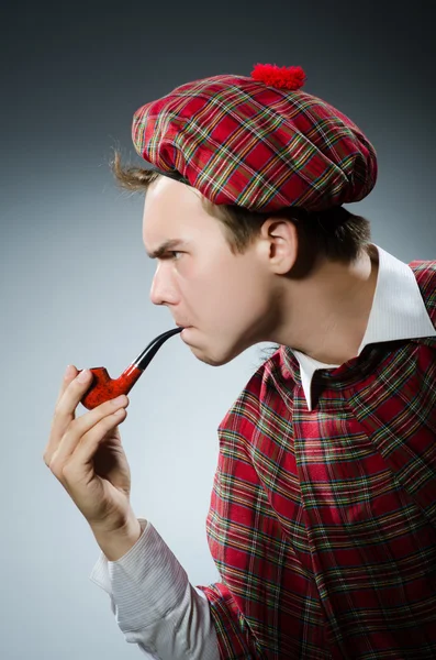 Funny scotsman smoking pipe tobacco — Stock Photo, Image