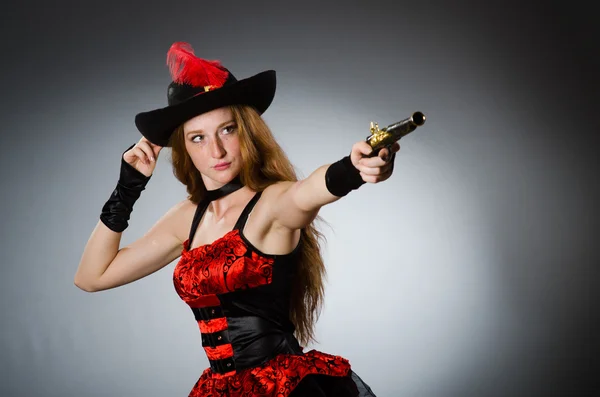 Pirate with gun against grey background — Stock Photo, Image