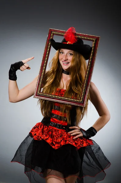 Woman pirate with picture frame — Stock Photo, Image