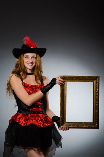 Woman pirate with picture frame — Stock Photo, Image