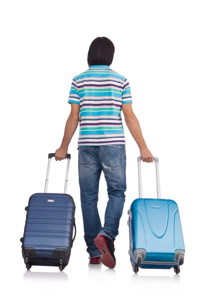 Young man travelling with suitcases isolated on white — Stock Photo, Image