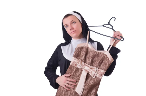 Nonne wählt Kleidung auf dem Kleiderbügel isoliert auf weiß — Stockfoto